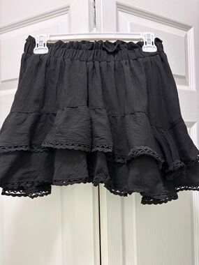 Black Tiered Ruffle Mini Skirt with shorts built in.